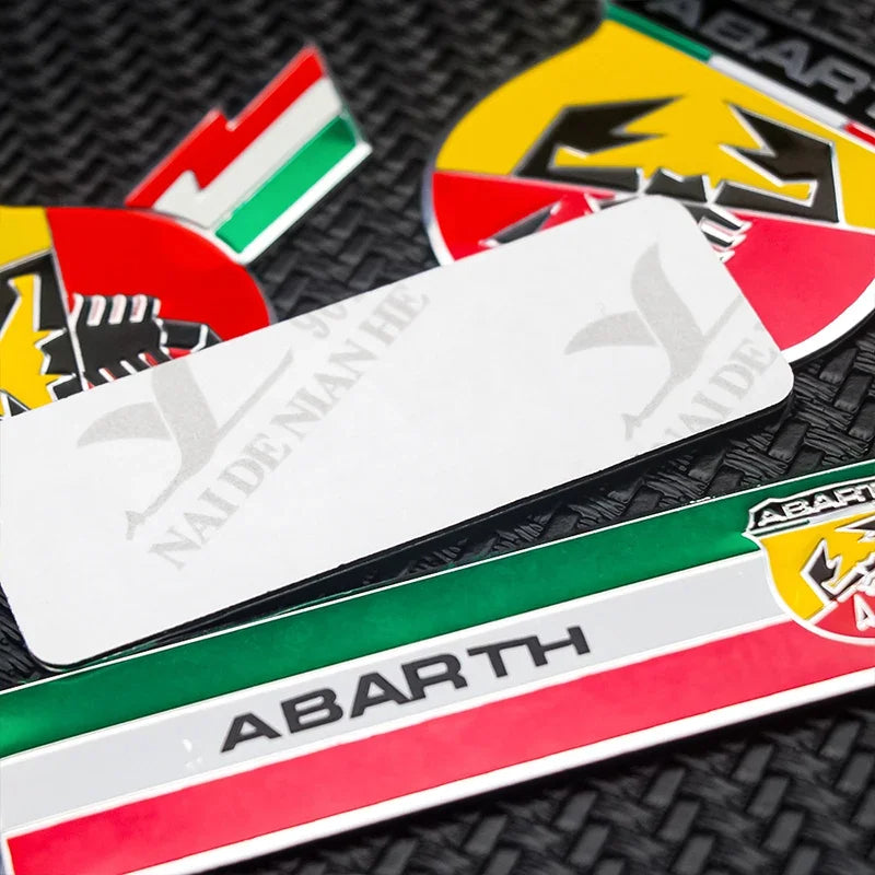 Abarth badge, here the photo shows the back of the badge - M-Pure Dynamics