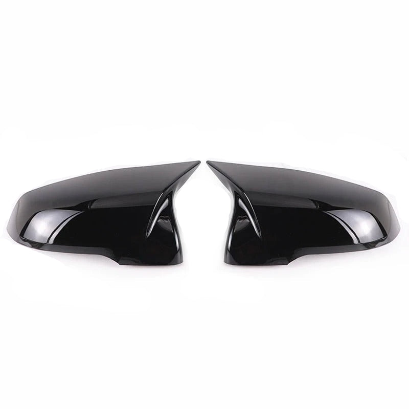 This photo shows up close the mirror caps mounted on the car, displaying the black variation