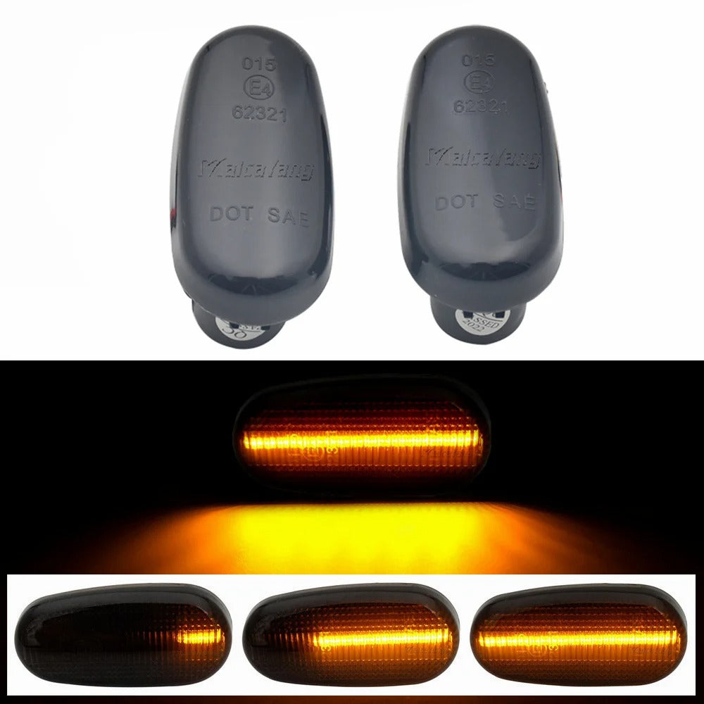 Two black reflective markers with 'Wolfgang' branding and a close-up of amber LED lights on a white background.