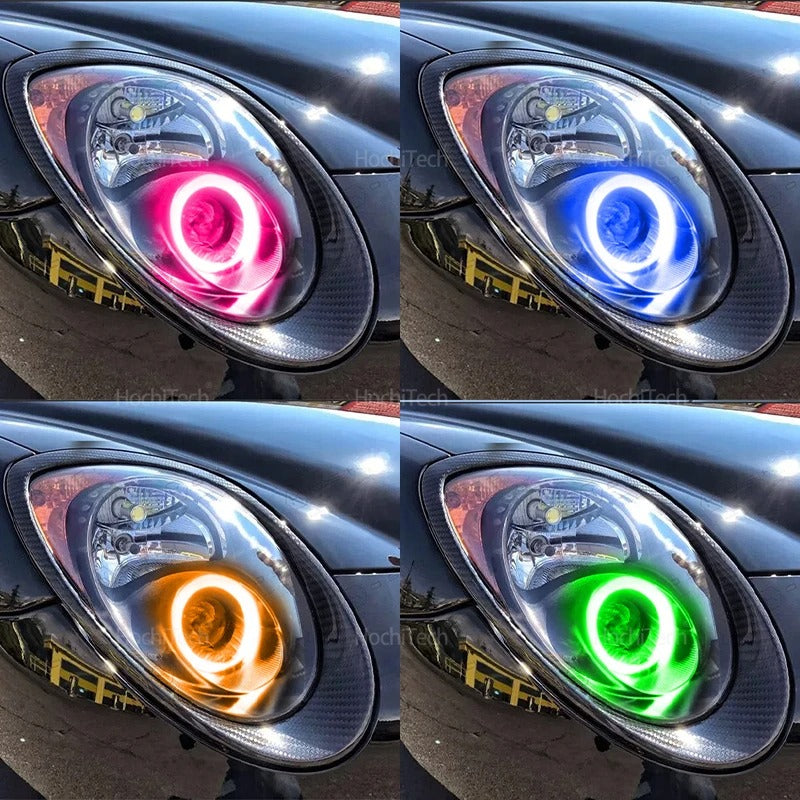 Car headlights in different colors (pink, blue, orange, green) on a black car background.