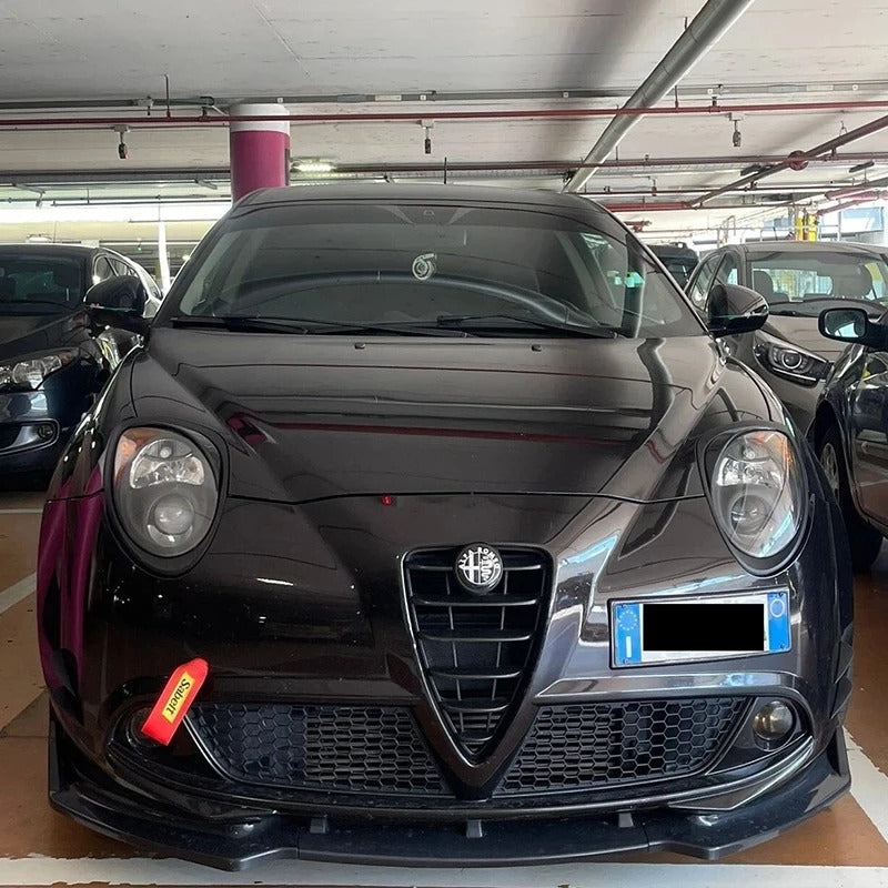 Black Alfa Romeo car in a parking garage