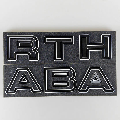 Abarth Letters for front Grillle for Abarth 500 and595, here the photo shows the product with the black style - M-Pure Dynamics