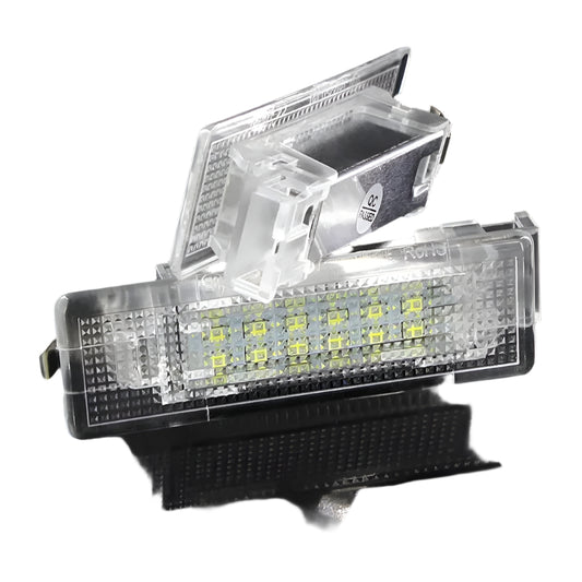 Car license plate light with clear cover on a black background