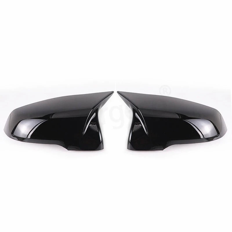 This photo shows up close the mirror caps mounted on the car, displaying the black variation
