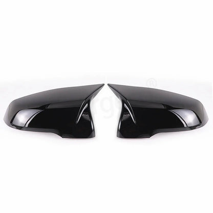This photo shows up close the mirror caps mounted on the car, displaying the black variation
