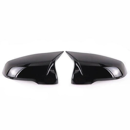 This photo shows up close the mirror caps mounted on the car, displaying the black variation
