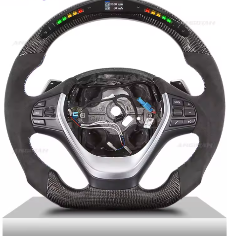 Carbon Fiber Steering Wheel with RPM LEDs for F20 F30 F32 3 serie M1 M2 M3 M4 X5 X6, the photo here shows the Carbon steering wheel upclose and shows the details - M-Pure Dynamics