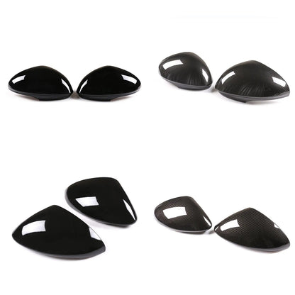 Carbon fiber car mirror cover set on a white background