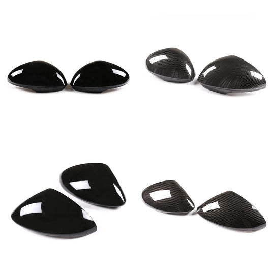 Carbon fiber car mirror cover set on a white background