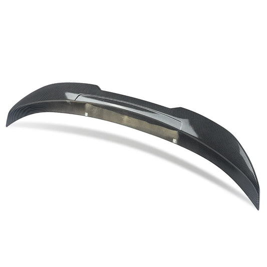 This Photo shows a carbon fiber spoiler with a white background