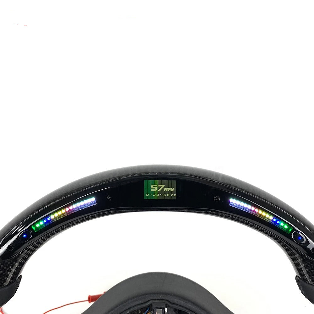 Carbon fiber rim with digital display on a white background, labeled 'Real Carbon'.