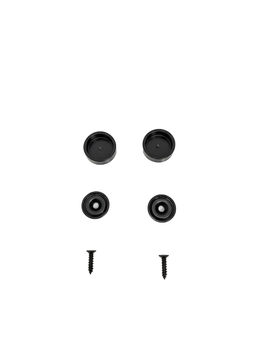 Four black circular objects and two screws on a white background