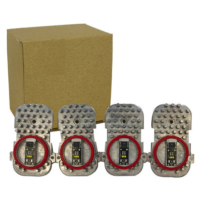Four metallic devices with red circular components on a white background